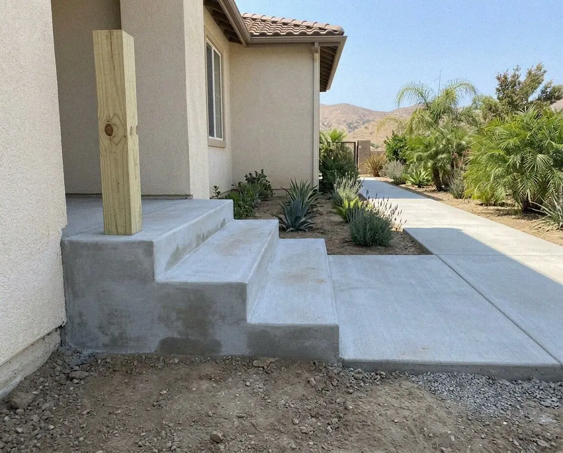 Newly poured concrete front steps with crisp nosings at a home in Orange